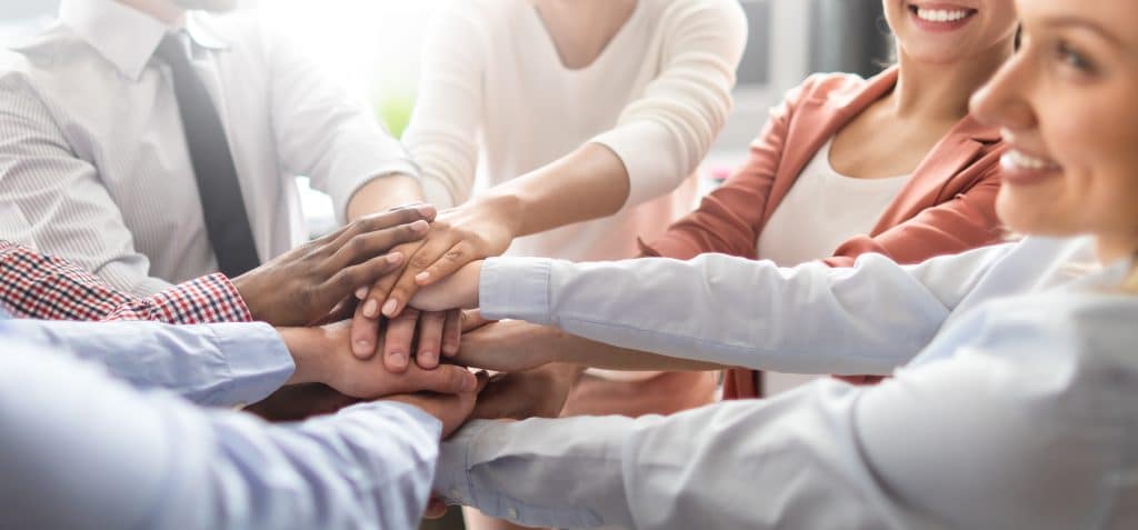 Stack of hands. Unity and teamwork concept.