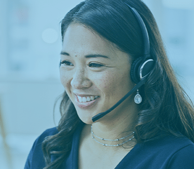 Smiling female customer service representative wearing a headset