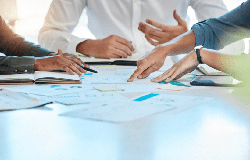 Business team analyzing order volume charts and operational data