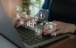 Person using laptop with data analytics and targeting icons overlay