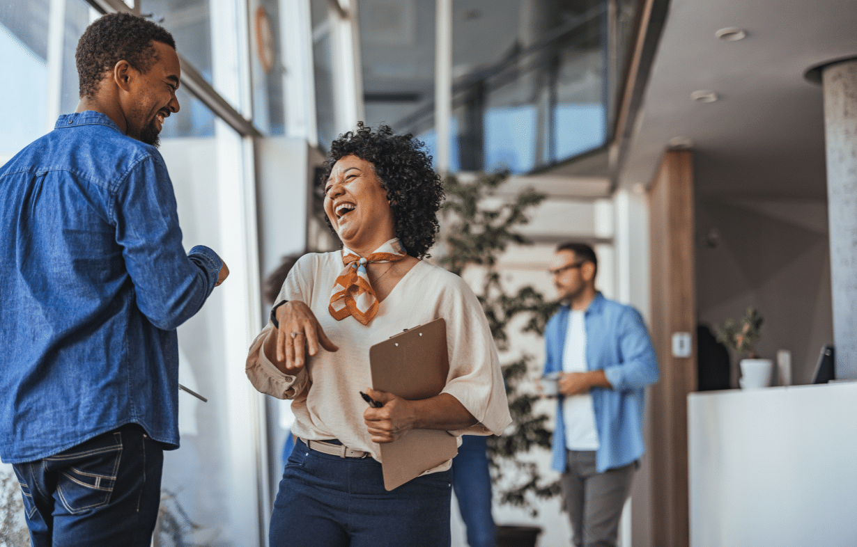 Qualfon associates share a genuine moment of connection in the workplace